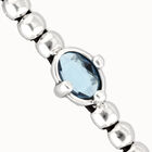 Beaded bracelet with blue oval faceted crystal